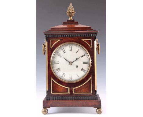 A SMALL REGENCY FIGURED MAHOGANY BRACKET CLOCK having a stepped chamfered pediment and gilt pineapple finial above a rectangu