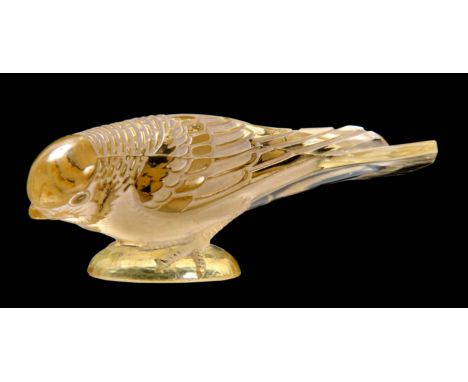 R LALIQUE  A BIRD PAPERWEIGHT  'CHARDONNARET MOQUEUR' in rare pale yellow highlighted with  staining  12.5cm across