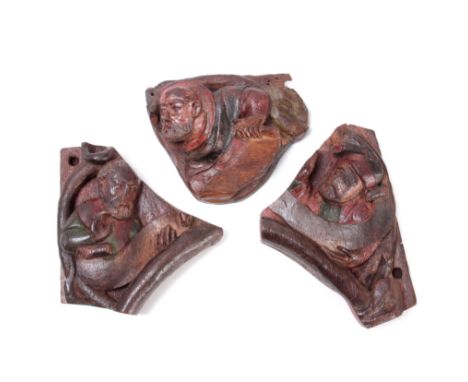 A RARE GROUP OF THREE 15THCENTURY POLYCHROME CARVED OAK FRAGMENTS probably depicting bust portrait subjects from the tree of 