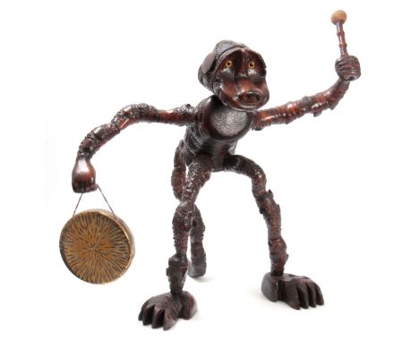 AN UNUSUAL LATE 19TH CENTURY NATURALISTIC KNOTCHED BRANCHWORK TABLE GONG AND BEATER FORMED AS A MONKEY - POSSIBLY BAMBOO with