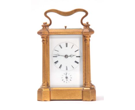 ROLLIN, PARIS. A MID 19th CENTURY FRENCH GILT BRASS REPEATING CARRIAGE CLOCK having faceted corners to the top of the case ab