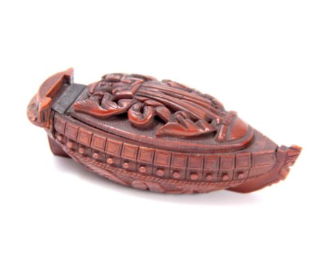 A FINE REGENCY CARVED COQUILLA NUT PRISONER OF WAR SNUFF BOX commemorating Napoleon's death, depicting him laying on a burnin