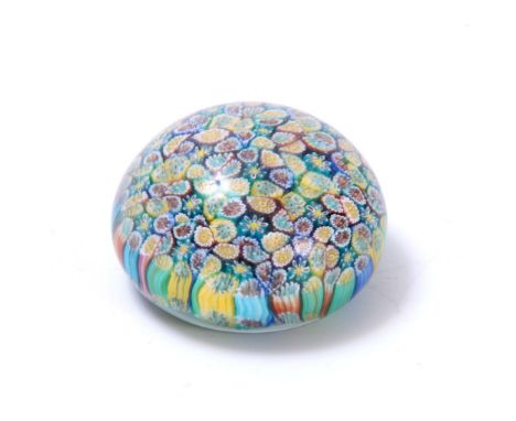 A BACCARAT STYLE GLASS PAPERWEIGHT with flowerhead decoration 7cm diameter 4.5cm high. 