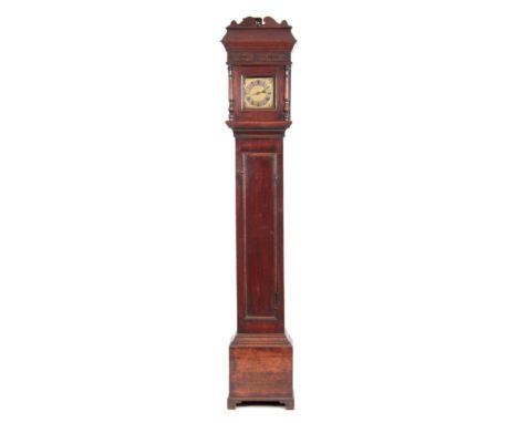 AN EARLY 18th CENTURY OAK CASED LONGCASE CLOCK OF SMALL PROPORTIONS having a shaped pediment above a blind fret and glazed do