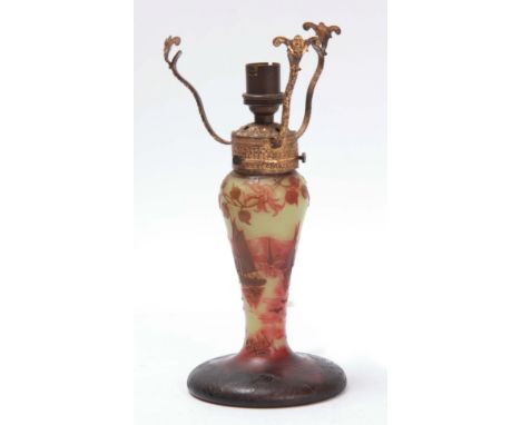 J. MICHAEL, PARIS A CAMEO GLASS TABLE LAMP on a circular shaded dark brown foot, the pale green inverted baluster stem with p