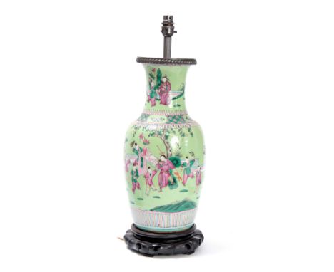 A 19TH CENTURY CHINESE PALE GREEN GROUND LARGE OVOID VASE/LAMP ON HARDWOOD BASE decorated with a continuous scene of figures 