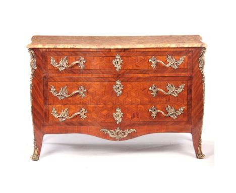 A 19TH CENTURY LOUIS XV STYLE KINGWOOD COMMODE OF BOMBE SHAPE with moulded edge veined top above three ormolu-mounted drawers