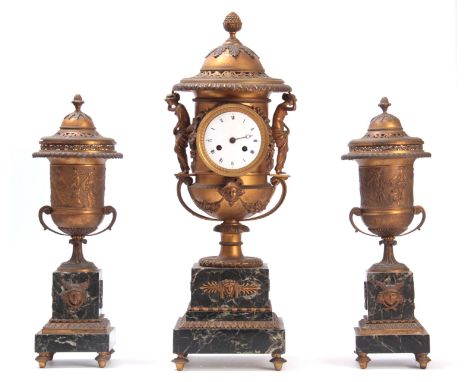 A FINE EARLY 19th CENTURY FRENCH ORMOLU AND MARBLE VASE SHAPED CLOCK GARNITURE the case with pierced domed lid surmounted by 