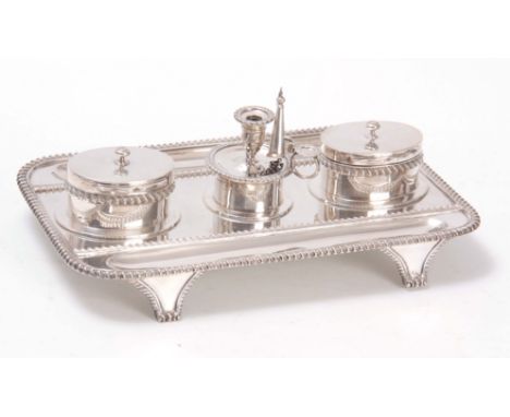 A LARGE LATE 19th CENTURY DOUBLE SIDED SILVER DESK STAND having a central removable chamber stick flanked by two oval inkwell