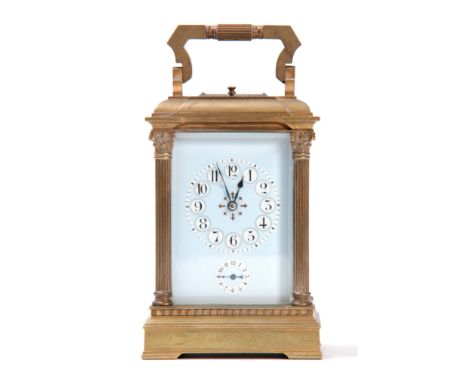 A LATE 19th CENTURY FRENCH GRAND SONNERIE REPEATING CARRIAGE CLOCK the brass moulded case with reeded corinthian column corne