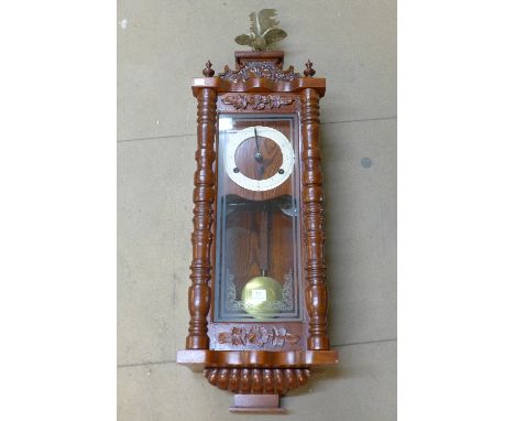 A mahogany Vienna style wall clock with fusee movement