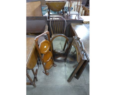 An Edward VII mahogany mirror, a Victorian mahogany toilet mirror, a mahogany folding cake stand and an elm seated chair
