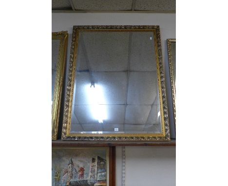 A gilt framed mirror