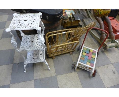 A metal jardiniere stand, bamboo magazine rack, carpet beater and child's pull-along toy