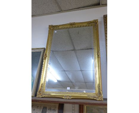 A gilt framed mirror