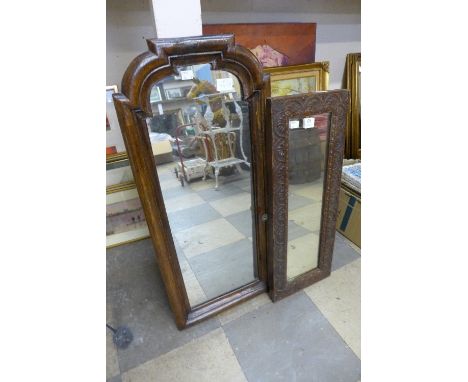 A George II style walnut cushion framed mirror and carved oak mirror