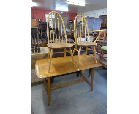 An Ercol style refectory table and two Ercol Golden Dawn chairs