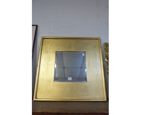 A gilt framed mirror