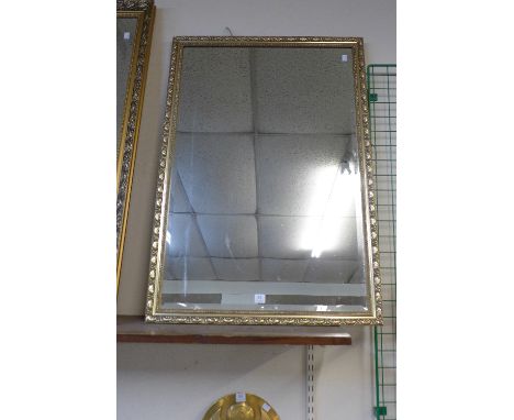 A gilt framed mirror