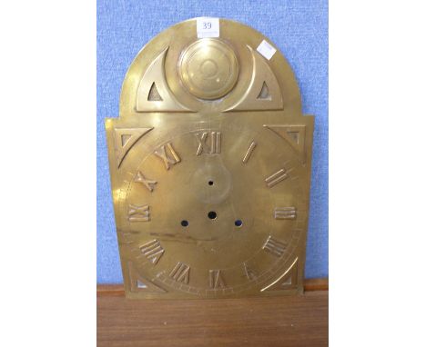 A brass longcase clock dial
