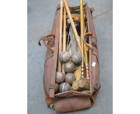 LEATHER BAG CONTAINING CRICKET BATS, BALLS AND ACCESSORIES, AND ALSO BOWLINE BOWLS, CROQUET EQUIPMENT AND HOCKEY STICK, ETC. 