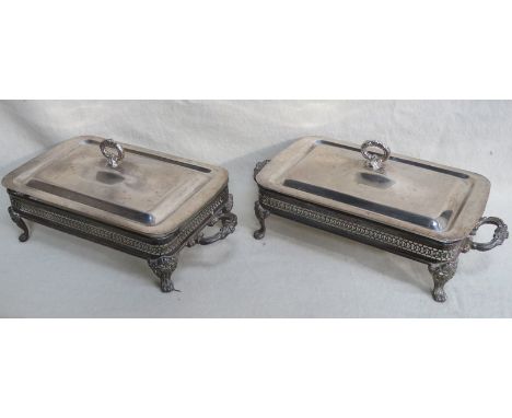 PAIR OF SILVER PLATED AND PIERCEWORK DECORATED TWO HANDLED VEGETABLE DISHES WITH PYREX GLASS LINERS, ON RAISED CLAW SUPPORTS 