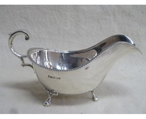 HALLMARKED SILVER 3/4 PINT SAUCE BOAT ON RAISED BALL AND CLAW FEET, JOSEPH ROGERS &amp; SONS, SHEFFIELD ASSAY, 1912, APPROXIM