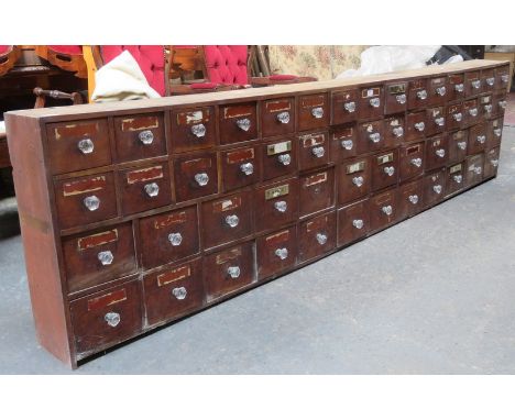 LATE VICTORIAN PHARMACEUTICAL FLIGHT OF FIFTY-FOUR DRAWERS 'DRUG RUN', AND ALSO ADDITIONAL NON-MATCHING PHARMACEUTICAL DRAWER