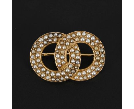 Brosche mit Saatperlen Ende 19. Jh.             Gelbgold 585 gestempelt. 3 x 2 cm. 6,4 g.             Doppelringbrosche mit e