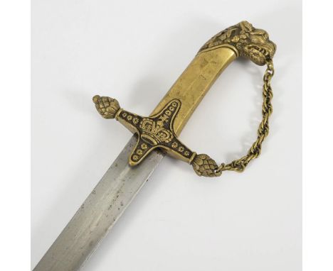 Britischer Löwenkopfsäbel mit Scheide. Großbritannien, Kolonien.             Gesamt L 86 cm.             Einfache einschneidi