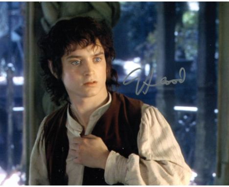 Lord of the Rings. Amazing 8x10 photo signed by actor Elijah Wood one of the leading stars of Lord of the Rings. Good conditi