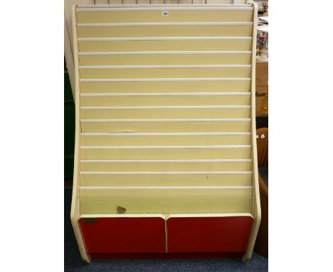 A MULTI SECTION CARD/LEAFLET DISPLAY CABINET with twin base drawers