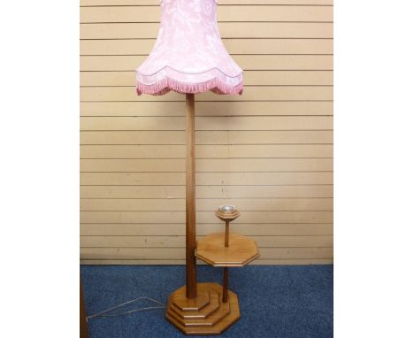 A CRAFTED WOODEN STANDARD LAMP with incorporated side table