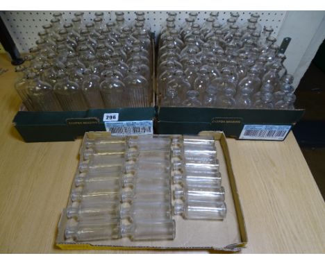 A LARGE COLLECTION OF CLEAR GLASS VINTAGE CHEMIST DISPENSARY BOTTLES namely with ribbed front feature, the others marked teas