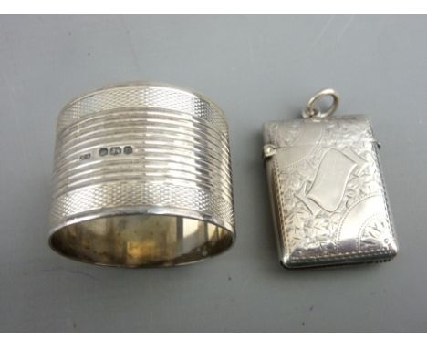 A BRIGHT CUT SILVER VESTA CASE, 0.8 troy ozs, Birmingham 1901 and an engine turned wide napkin ring, 1.3 troy ozs, Sheffield 