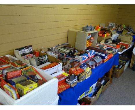 AN AMASSED COLLECTION OF MAINLY HORNBY AND TRIANG MODEL TRAIN LAYOUT - materials, equipment and buildings with a large quanti