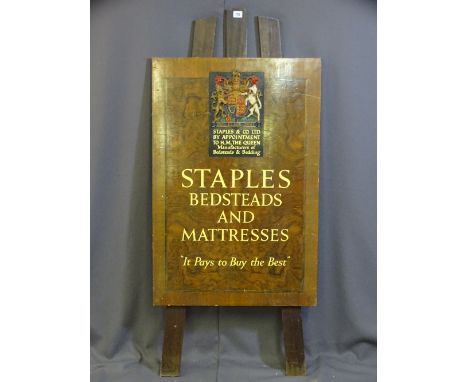 A VINTAGE ADVERTISING EASEL with coat of arms and 'Staples and Co Ltd By Appointment to H.M. The Queen' manufacturers of beds