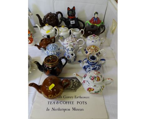 A COLLECTION OF VINTAGE AND LATER TEA POTS - including a hand painted Herend example, a Copeland treacle glaze pot after the 