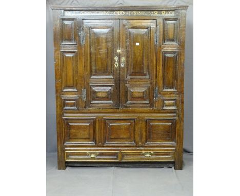 A LATE 17TH CENTURY BULK LIVERY CUPBOARD with a narrow date band to the top, 1699MM and two central fielded panel cupboards w