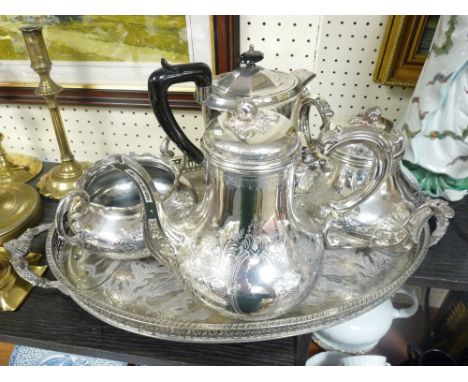 A VICTORIAN THREE PIECE TEA SERVICE with bright decoration, a litre hot water jug and a two handled oval gallery tray