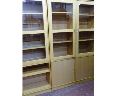 A MODERN LIGHT WOOD AND GLAZED DISPLAY CABINET system of separate items