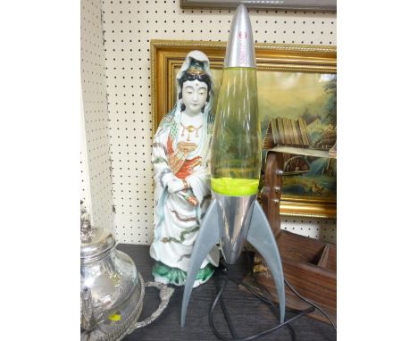 AN EARLY 20TH CENTURY ORIENTAL PORCELAIN FIGURINE and a Mathmos Lunar Rocket lava lamp E/T