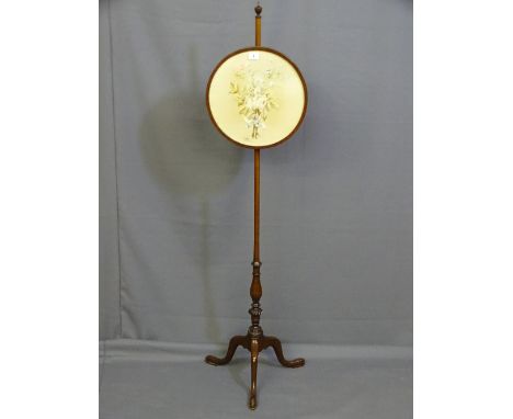 A NEAT MAHOGANY TRIPOD PULL SCREEN with circular floral silk panel and carving to the column base on pad feet