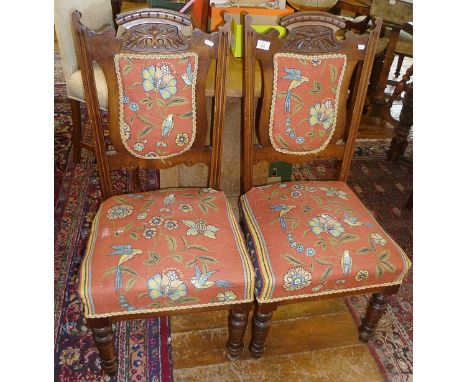 Pair of Edwardian carved oak dining chairs with tapestry style upholstery
