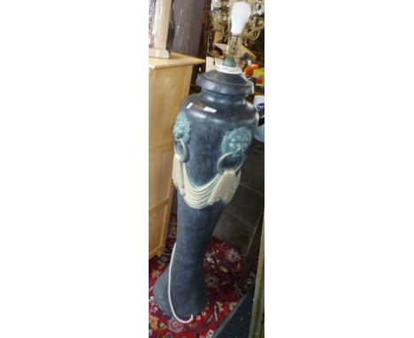Large classically inspired urn shaped painted plaster lamp standard base having lions heads and swags
