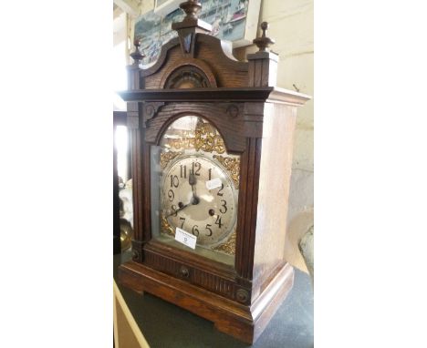 Victorian oak cased mantle clock with arched dial