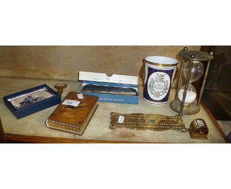 Olivewood covered photo album, handmade (possibly Trench Art) brass cribbage board, brass whist marker, brass hourglass and a
