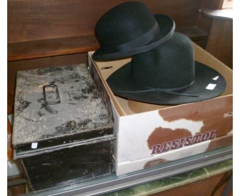 A Resistol cowboy hat in box, a bowler hat and a tin trunk