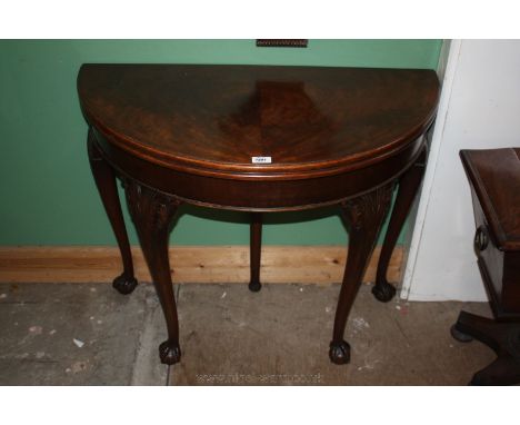 A superb 19th c. Mahogany fold-over demi-lune Card Table having well figured moulded edge top with mirrored grain, opening to