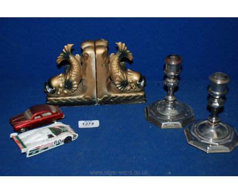A Corgi Jaguar XJR9 model car, Dinky Saab 96 car, pair of plated candlesticks and pair of plaster Dolphin Bookends